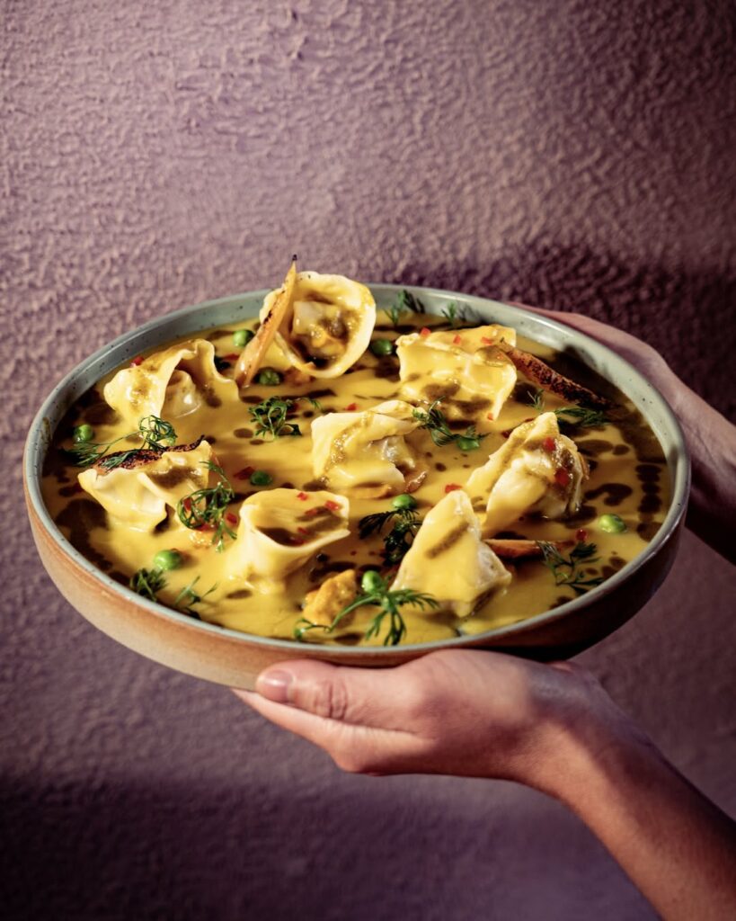 Viagem para Cusco: prato de tortellini cremoso em restaurante Chicha